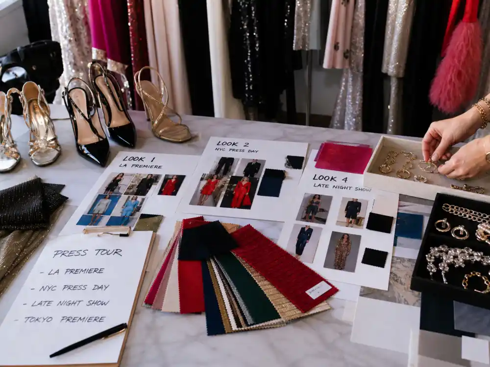 Press tour wardrobe planning table with look boards illustrating Molly Dickson celebrity stylist clients film promotion styling strategy and accessory math