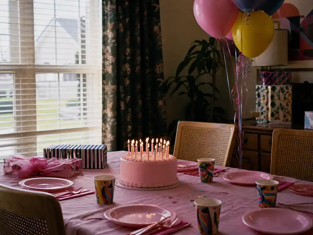 A 1980s birthday cake table evoking Molly Ringwald Sixteen Candles John Hughes breakthrough