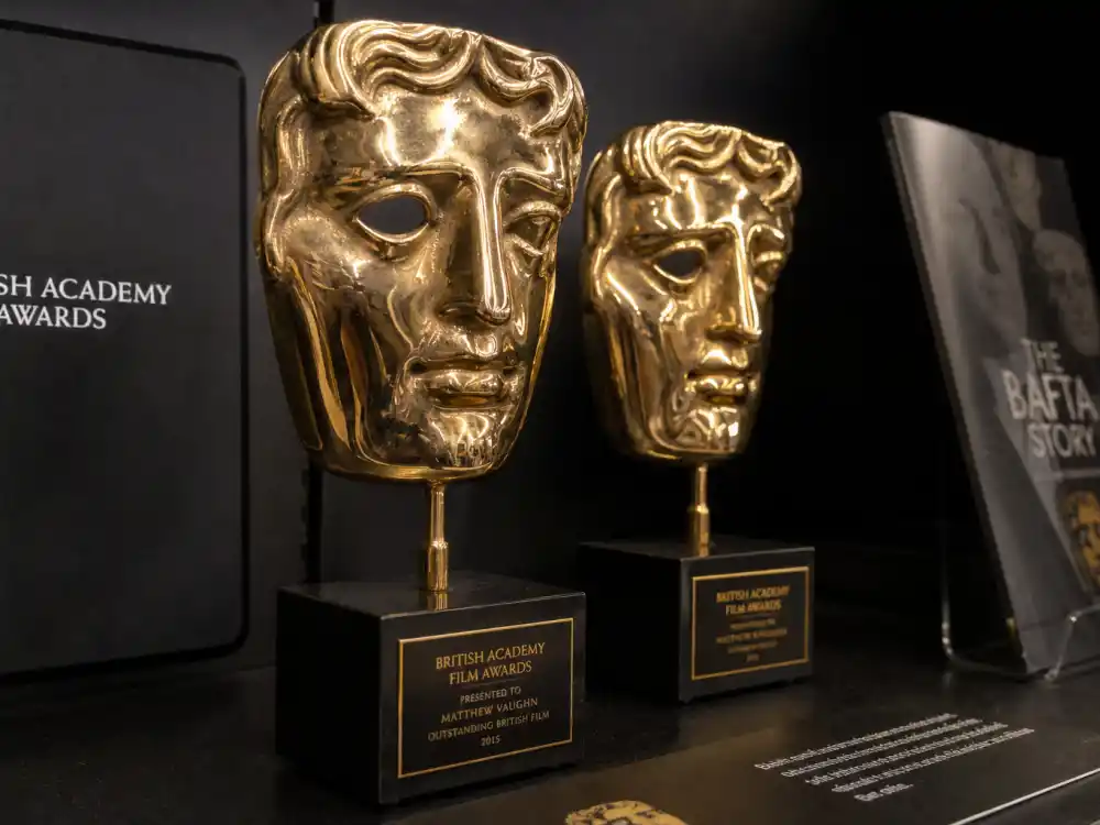 Golden BAFTA mask trophies on display for the most BAFTAs won by an actor acting-record guide