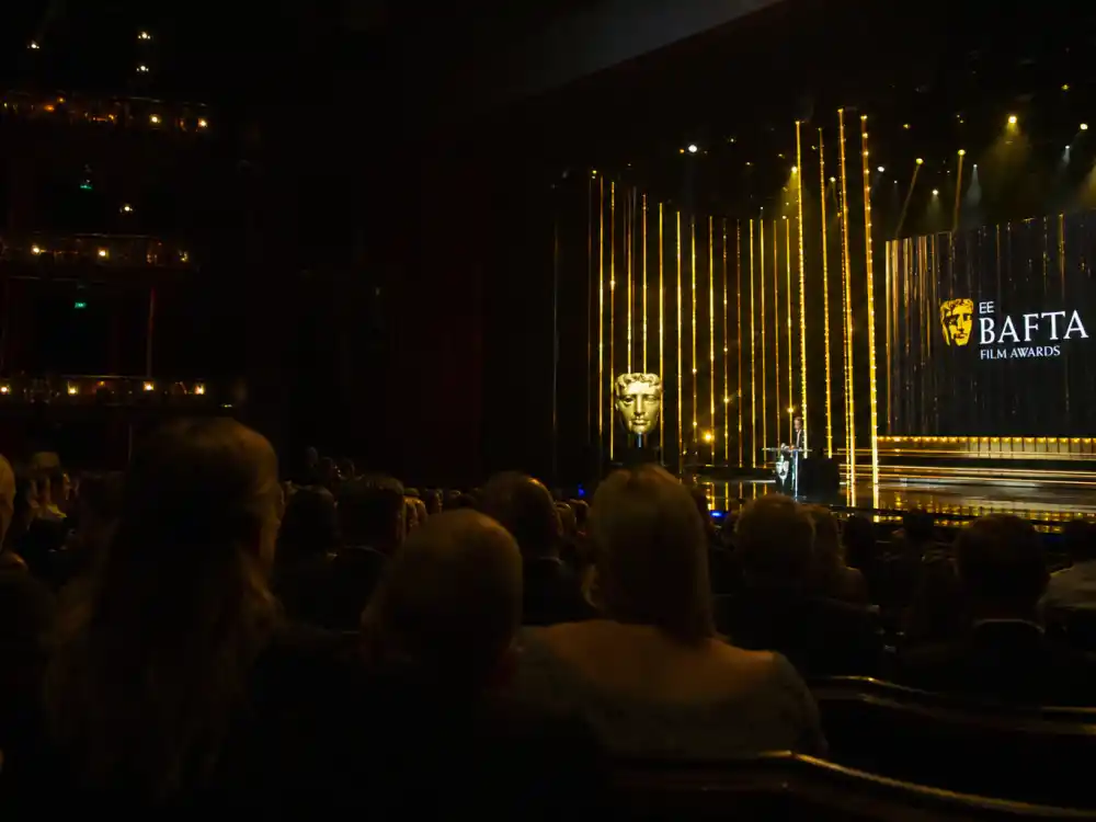 BAFTA awards ceremony auditorium atmosphere tied to the most BAFTAs won by an actor leaderboard