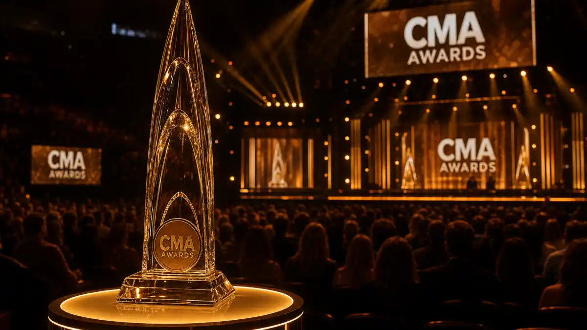 Most CMA awards won by an artist — ornate CMA Awards glass trophy on illuminated Nashville arena stage with golden spotlights
