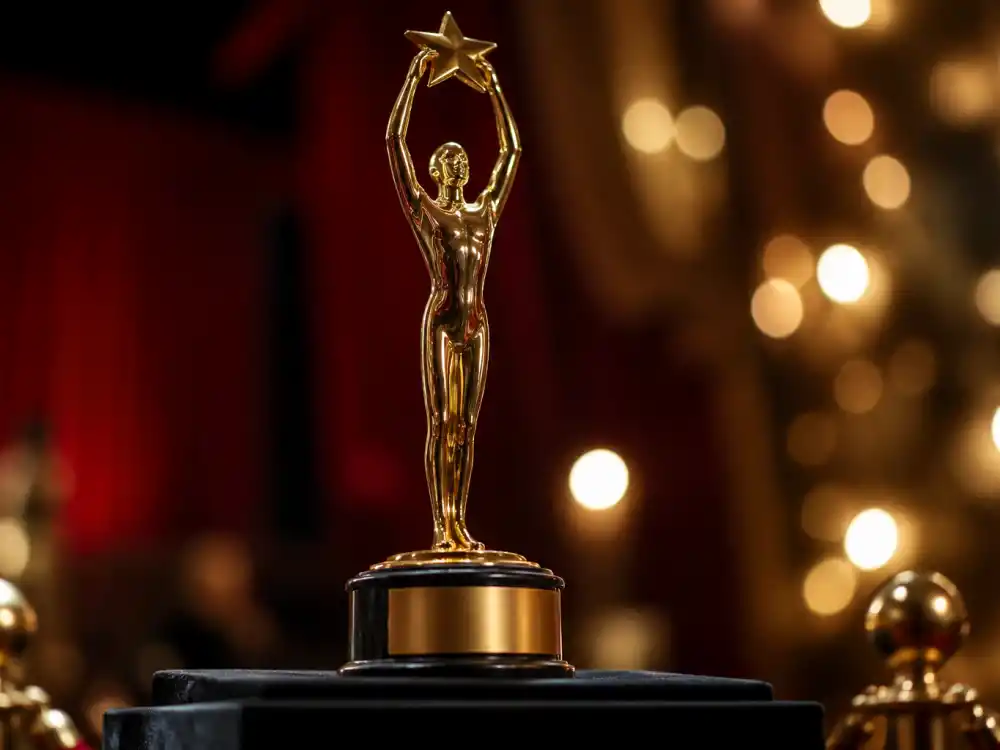 Golden film award trophy silhouette symbolizing the most iconic Oscar moments of all time across nine decades of ceremonies