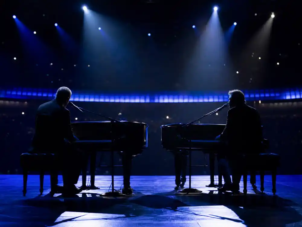 Two pianos facing each other under blue spotlights recall the Elton John and Eminem duet among most memorable Grammy performances ever
