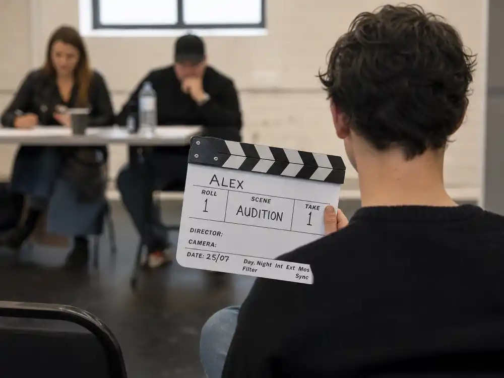 Indie audition slate with first-name-only clapperboard for nepo babies succeeding without famous last names separate billing editorial without faces