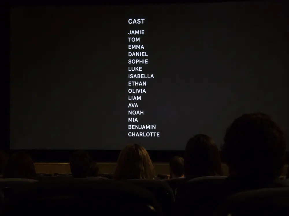 Theater marquee with first-name-only billing for nepo babies succeeding without famous last names stage identity editorial without faces