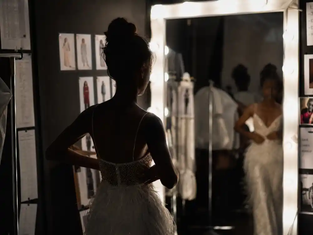 Fashion runway backstage mirror for nepo babies who made it on their own Kaia Gerber modeling career milestone editorial silhouette