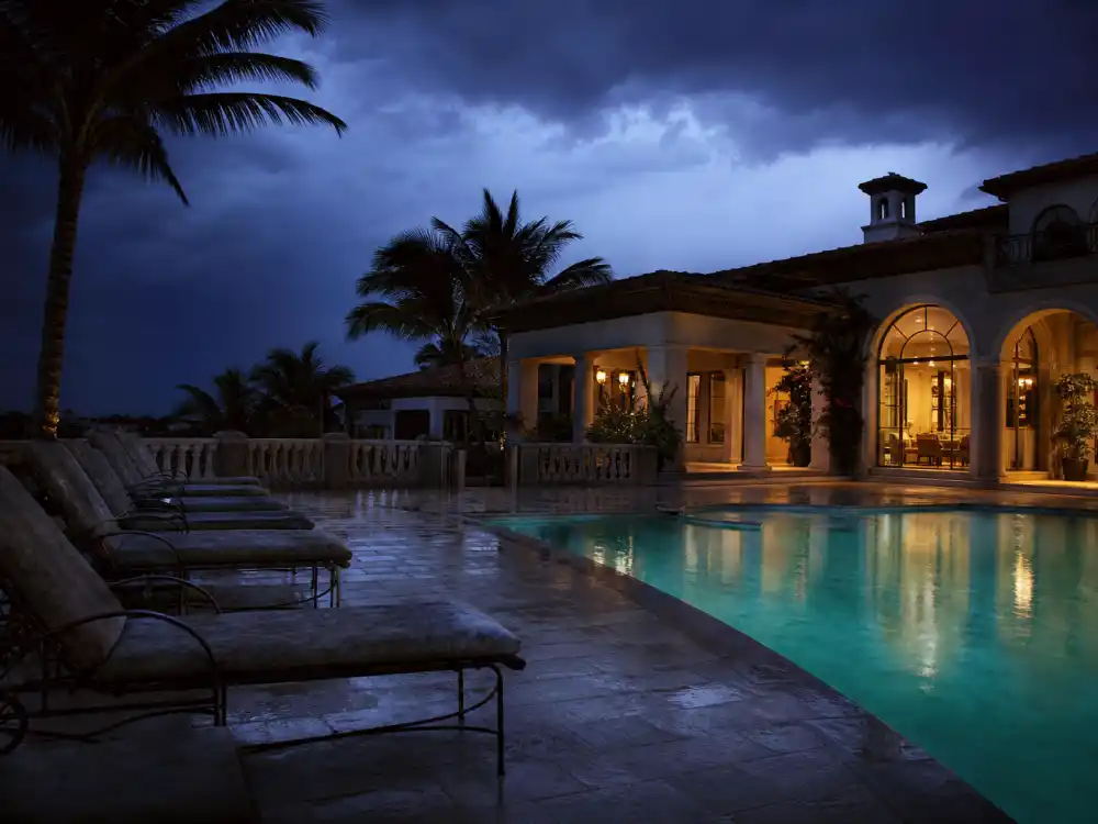 Florida mansion pool at twilight for Neve Campbell Wild Things 1990s thriller era
