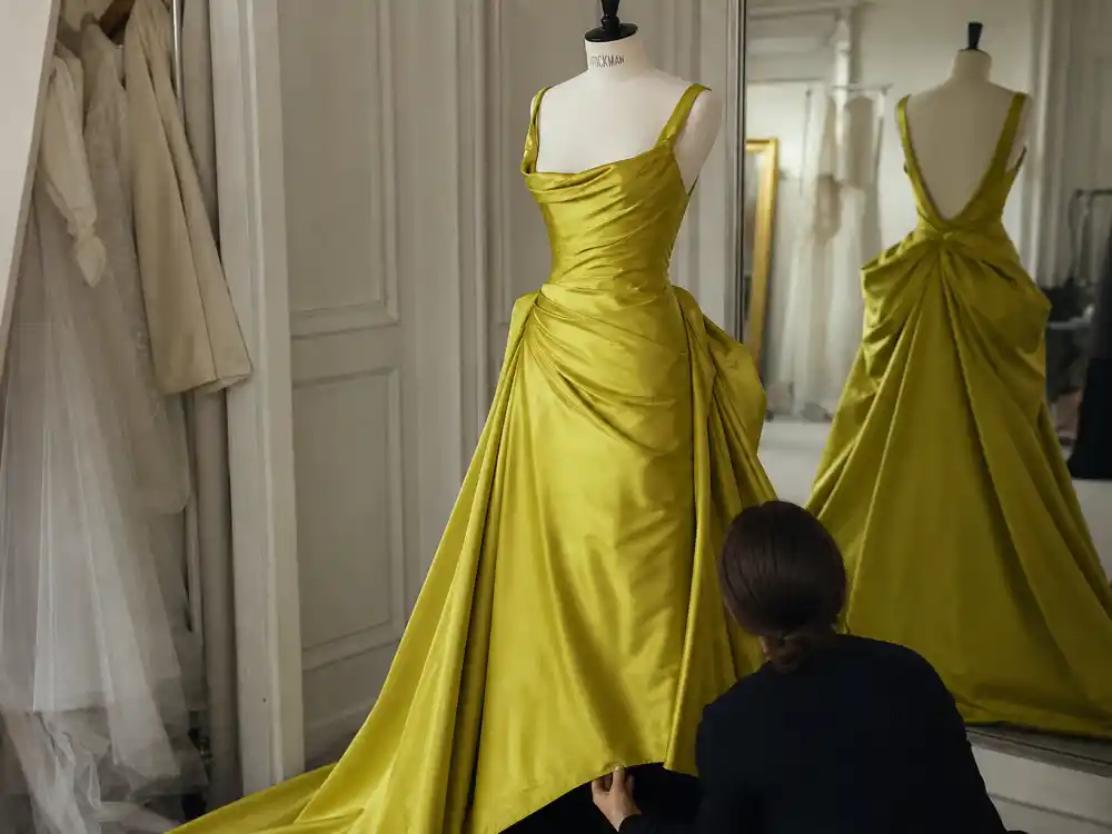 Couture fitting room preparation behind Nicole Kidman chartreuse David Bowie dress custom Dior construction and red-carpet rehearsal discipline