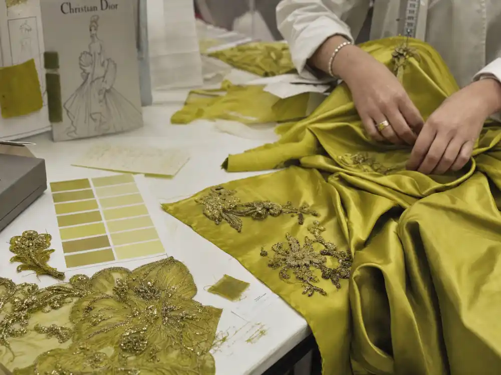 John Galliano Dior haute couture atelier craftsmanship central to Nicole Kidman chartreuse David Bowie dress era and 1997 Oscar red carpet revolution
