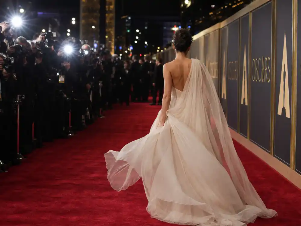 Oscars red carpet evening arrivals atmosphere surrounding Nicole Kidman chartreuse David Bowie dress legacy and 1997 Academy Awards fashion turning point
