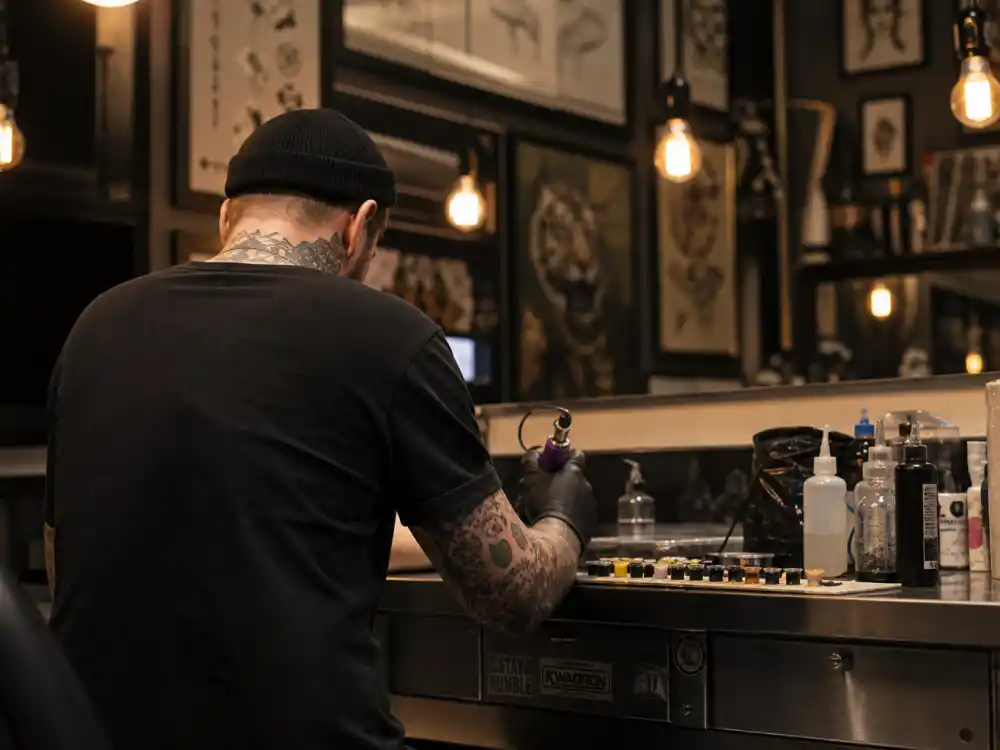 Tattoo parlor workstation from behind for where is Noah Hathaway now as professional tattoo artist