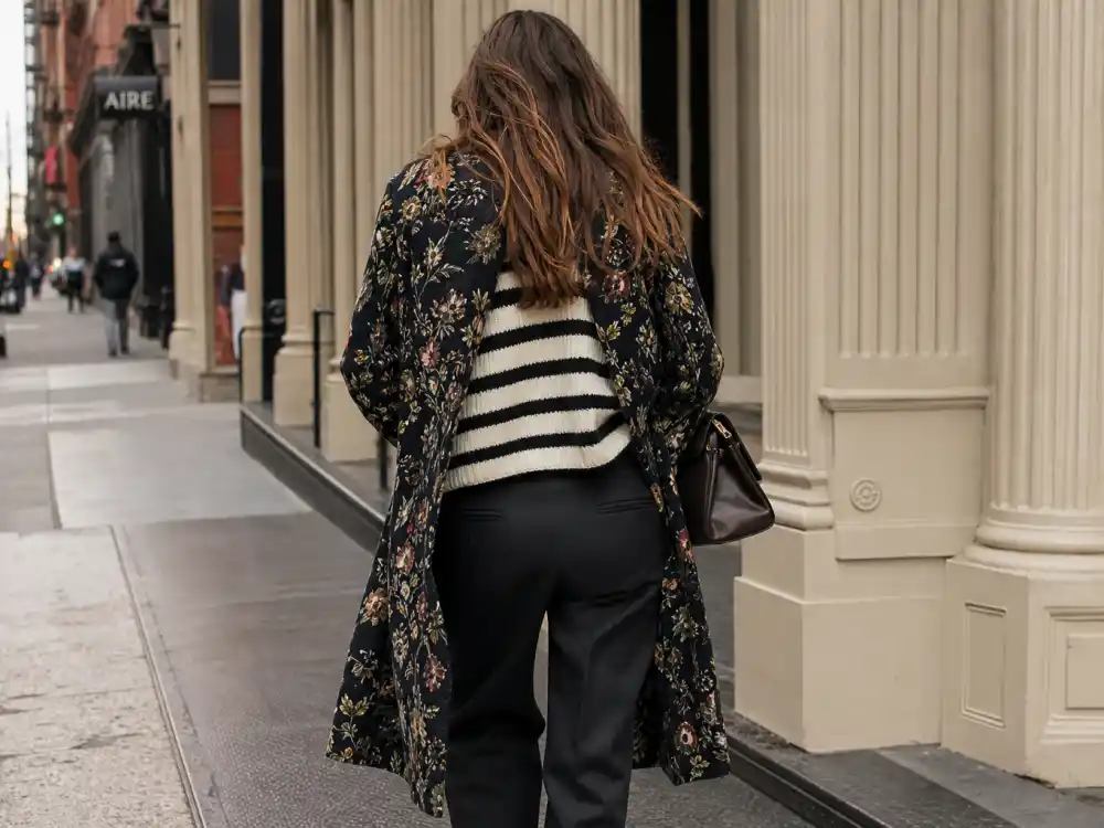 Tasteful striped knit and floral coat pattern mixing behind Olivia Palermo street style guide eclectic chic