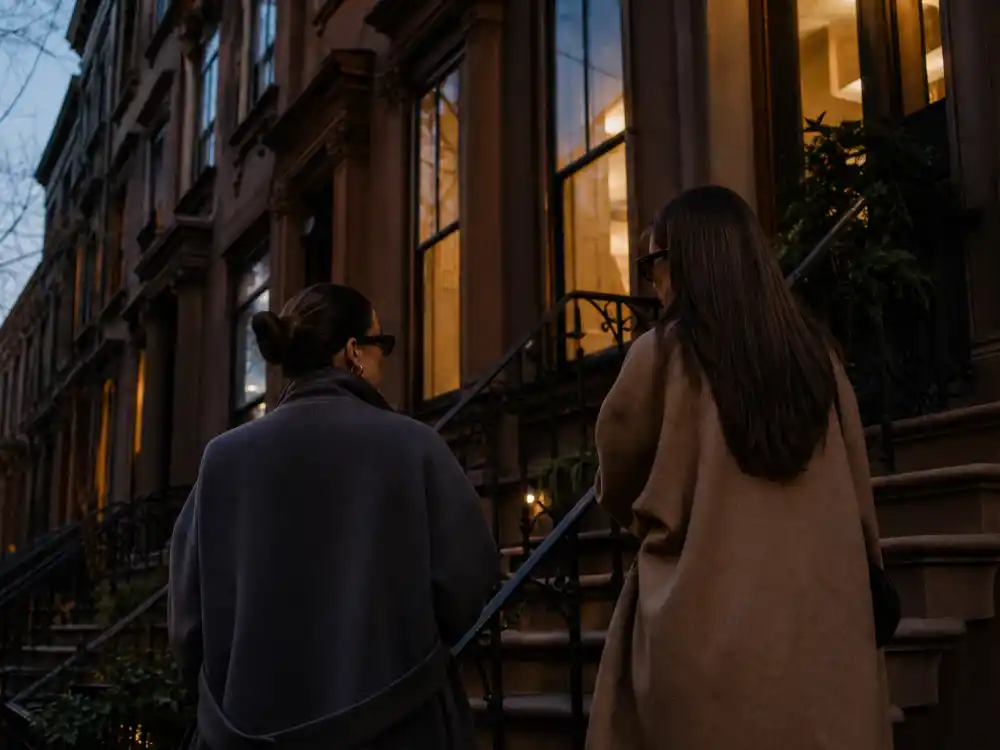 NYC brownstone steps at dusk for where Mary-Kate and Ashley Olsen live now in privacy