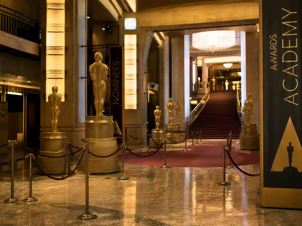 Grand theatre lobby atmosphere for Oscar nominations 2026 snubs and surprises coverage at the 98th Academy Awards