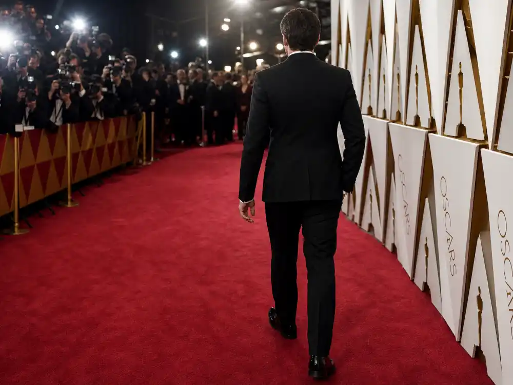Classic black tuxedo on Oscar red carpet illustrating menswear entries in Oscar red carpet best dressed all time ranked verdicts