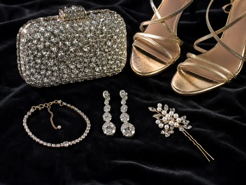 Diamond drop earrings crystal clutch strappy silver heels and bracelet flat lay completing accessory stacking rules for Oscars celebrity fashion 2026 Academy Awards finishing touches