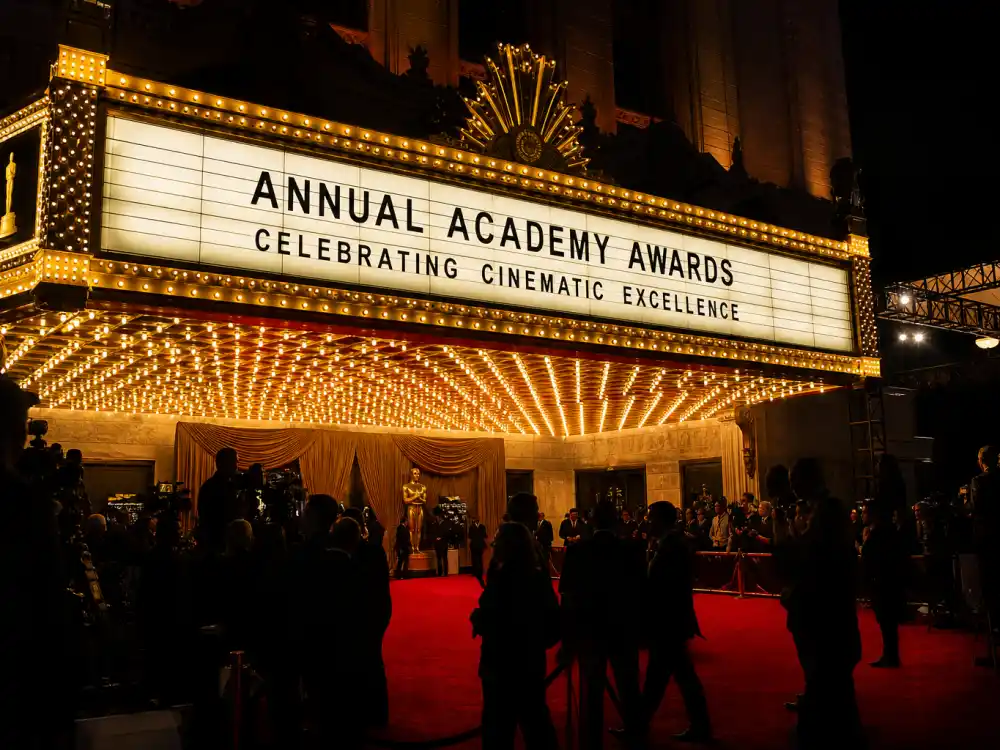 Theatre marquee lights glow before nights when the best Oscars hosts of all time step onto the Academy Awards stage in Los Angeles