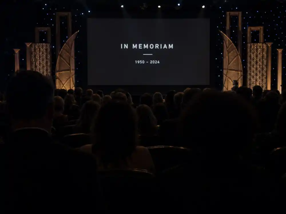 Audience silhouettes in respectful silence during a memorial montage explain why Oscars In Memoriam biggest omissions spark instant social reaction