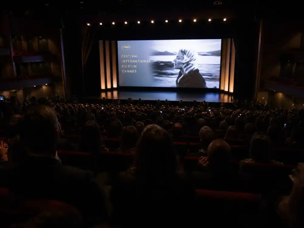 Grand theatre screening room evoking Palme d'Or winners list by year competition premieres at Cannes