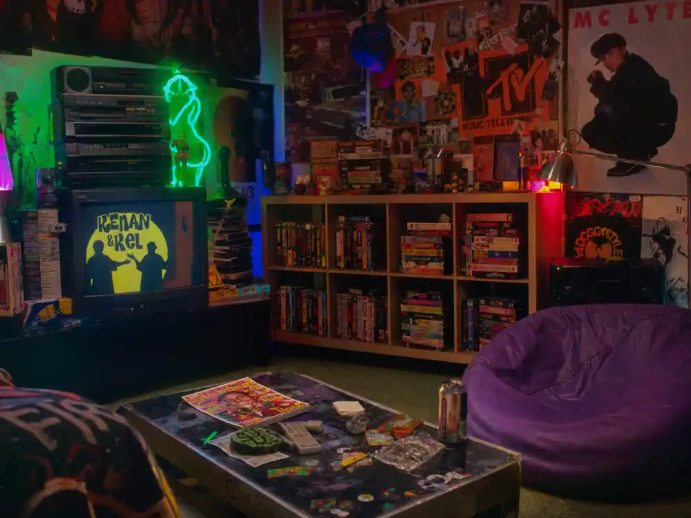 A 1990s MTV-style room evoking Pauly Shore Weasel era fame on television