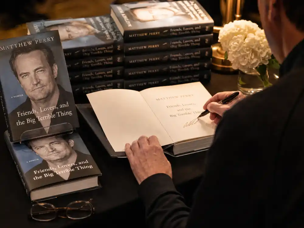 A bookstore signing table for Ralph Macchio memoir Remain Standing hardcover launch event