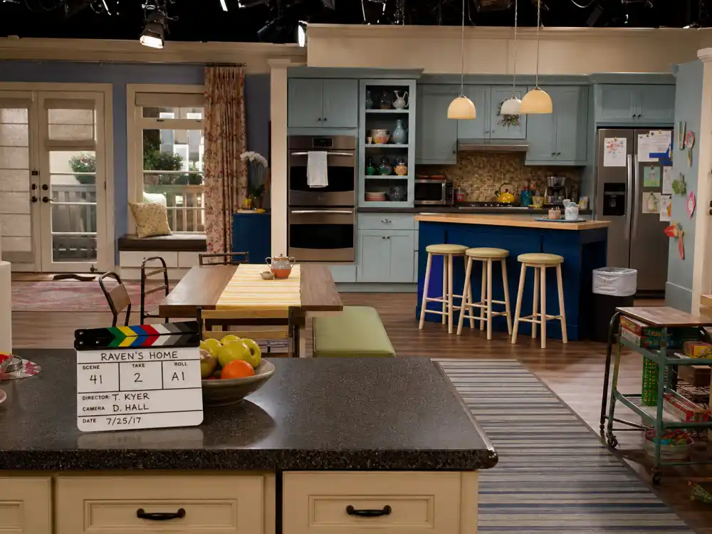 A contemporary sitcom kitchen set evoking Raven-Symoné return in the Disney Channel spinoff Raven's Home