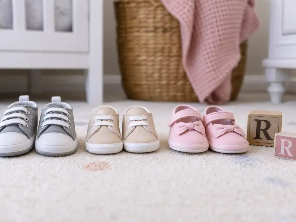 Three pairs of tiny baby shoes with R blocks for Rihanna baby third child family — RZA Riot and Rocki sibling context