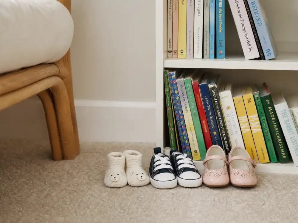Three pairs of childrens shoes by size in Rihanna family life Barbados and LA — RZA Riot and Rocki Mayers sibling spacing without faces in frame