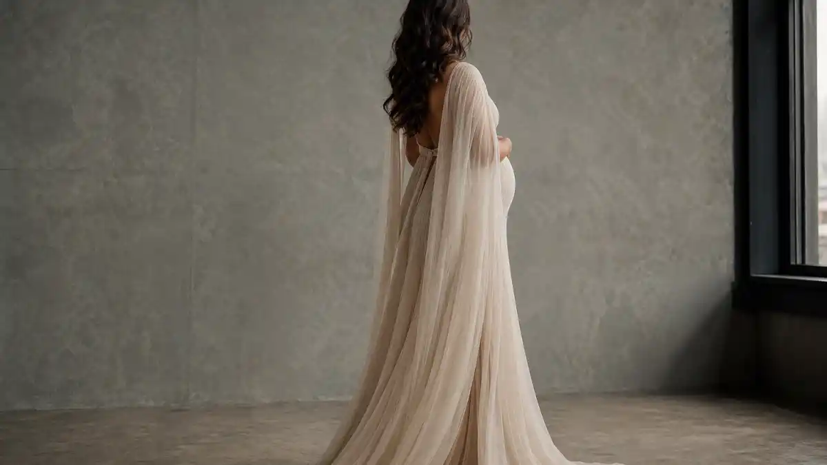 Rihanna maternity leave comeback timeline — maternity fashion silhouette in flowing designer gown without faces marking verified motherhood and return arcs