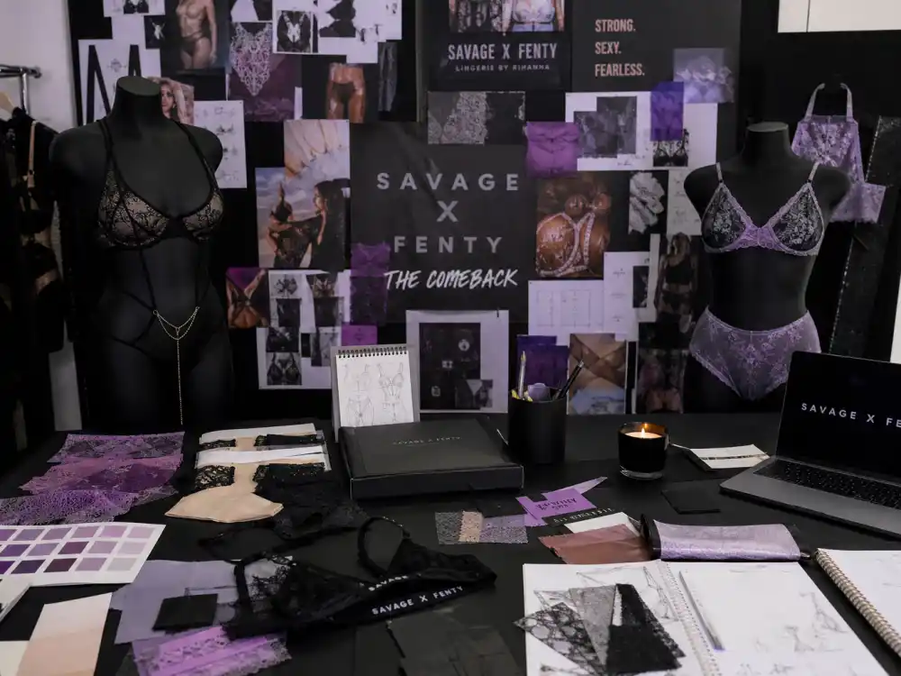 Savage X Fenty lingerie brand workspace with product samples in Rihanna maternity leave comeback timeline — fashion comeback arc between births