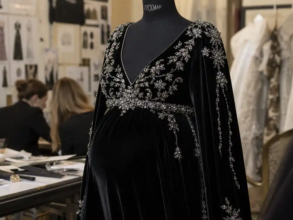 Crystal-embellished black velvet maternity gown on mannequin defining Rihanna maternity red carpet looks embellished bodice styling