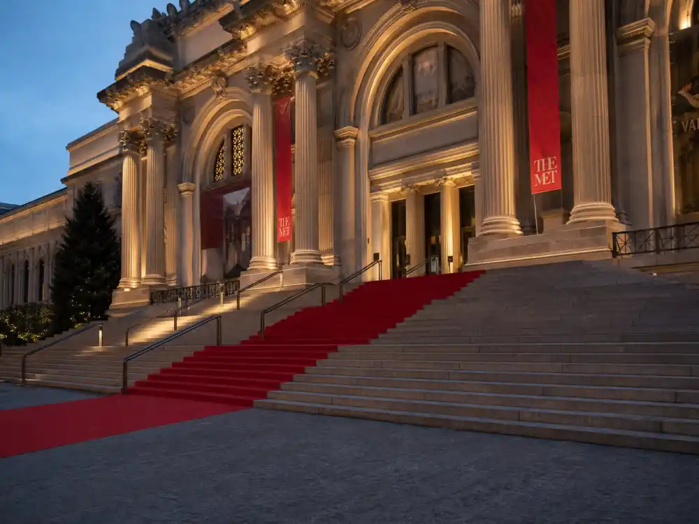 Metropolitan Museum grand staircase at dusk — the red carpet stage where the Rihanna papal Met Gala outfit made fashion history in 2018