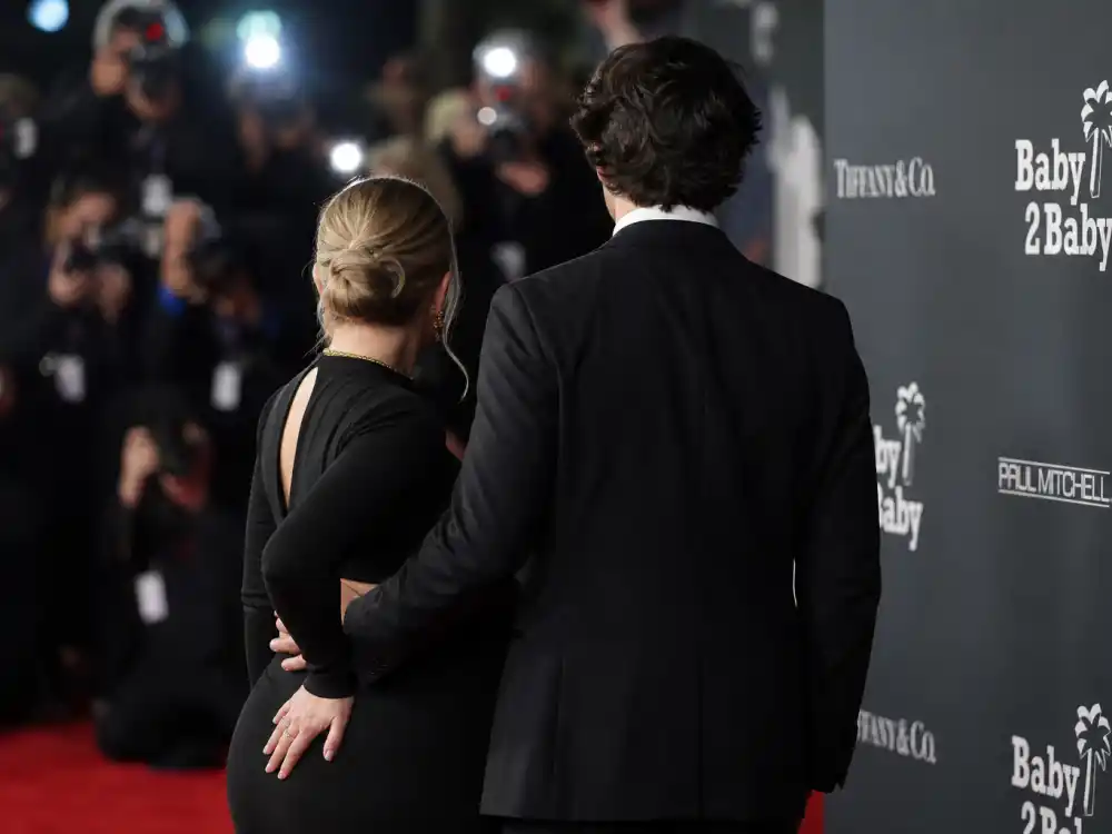 Anonymous tuxedo figure from behind on red carpet for Rihanna pregnancy announcement ASAP Rocky co-chair confirmation quotes