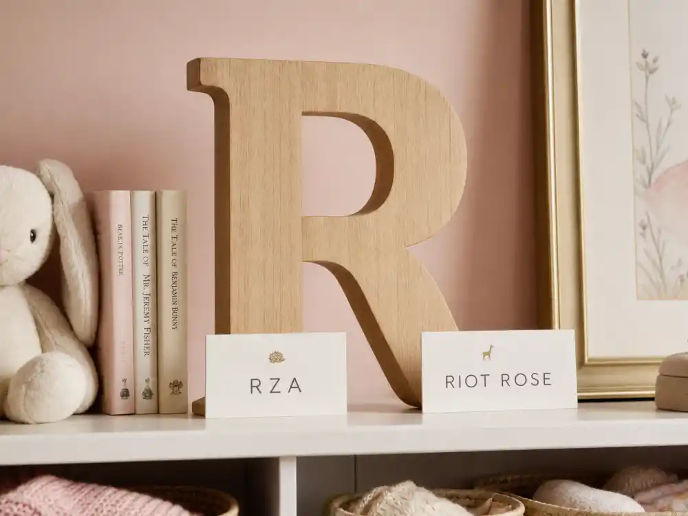 Wooden R letter blocks with RZA and Riot Rose name cards for Rihanna sons RZA and Riot Rose guide Mayers R-initial tradition