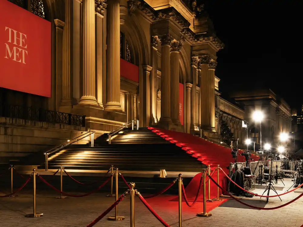 Metropolitan Museum grand staircase at the Met Gala — the red carpet stage where the Rihanna yellow Met Gala cape dress made history in 2015
