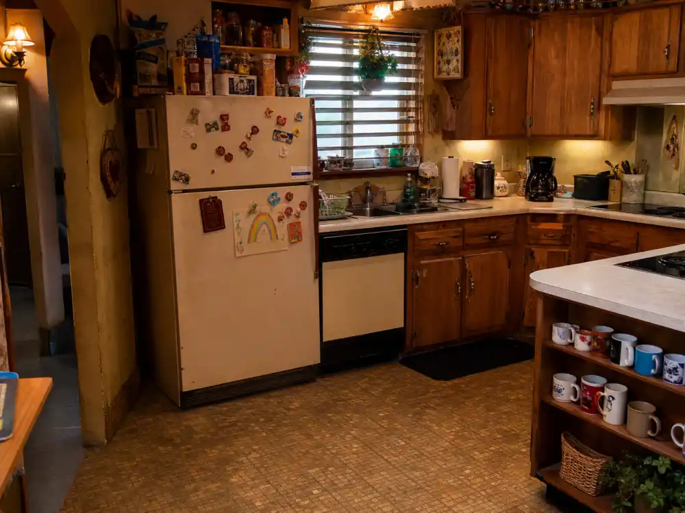 Cozy 1990s working-class kitchen interior evoking the Roseanne cast where are they now Conner family home