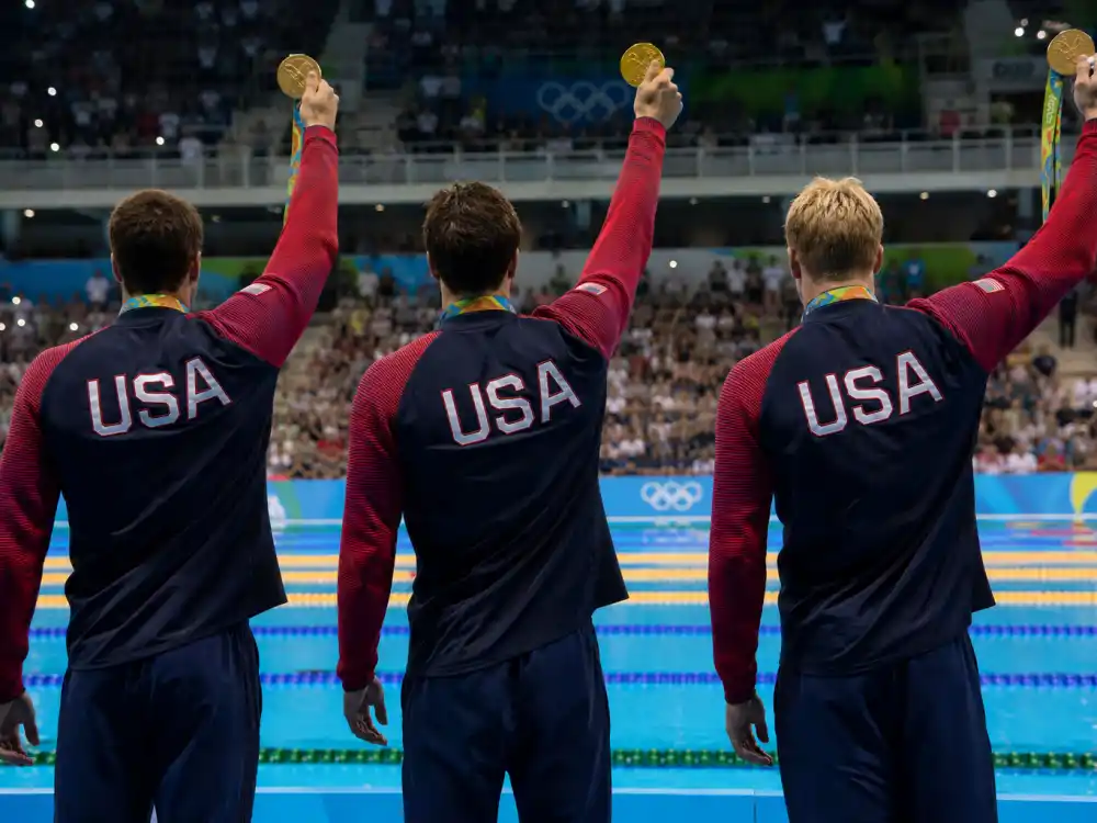 Olympic medal podium atmosphere for what happened to Ryan Lochte during USA swimming gold medal years