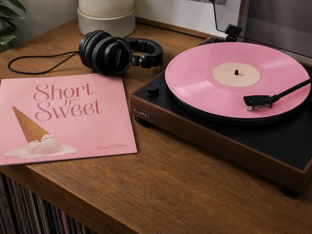 Short n Sweet vinyl record on turntable reflecting Sabrina Carpenter age and birthday 2026 at her chart-topping 2024 pop album milestone
