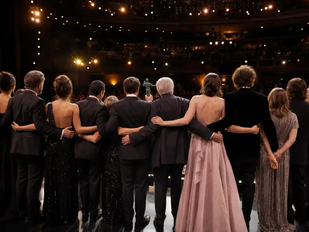 Ensemble cast on awards stage for SAG Awards vs Oscars predictor explained — the guild Outstanding Performance by a Cast category drives Best Picture handicapping