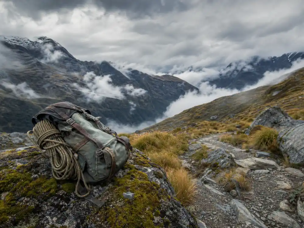 A misty mountain hiking trail with backpack evoking Sean Astin as Samwise Gamgee in Lord of the Rings