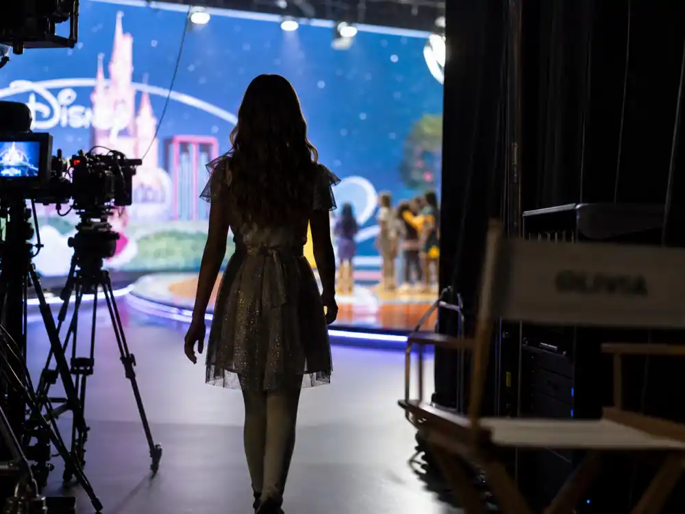 Television studio set reflecting Selena Gomez age and birthday 2026 milestone timeline across Disney Channel fame, streaming hits, and Emmy-nominated acting roles