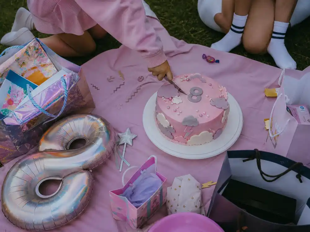 Number eight birthday party setup for Stormi Webster age and personality — playful storm-themed cake and celebration without faces