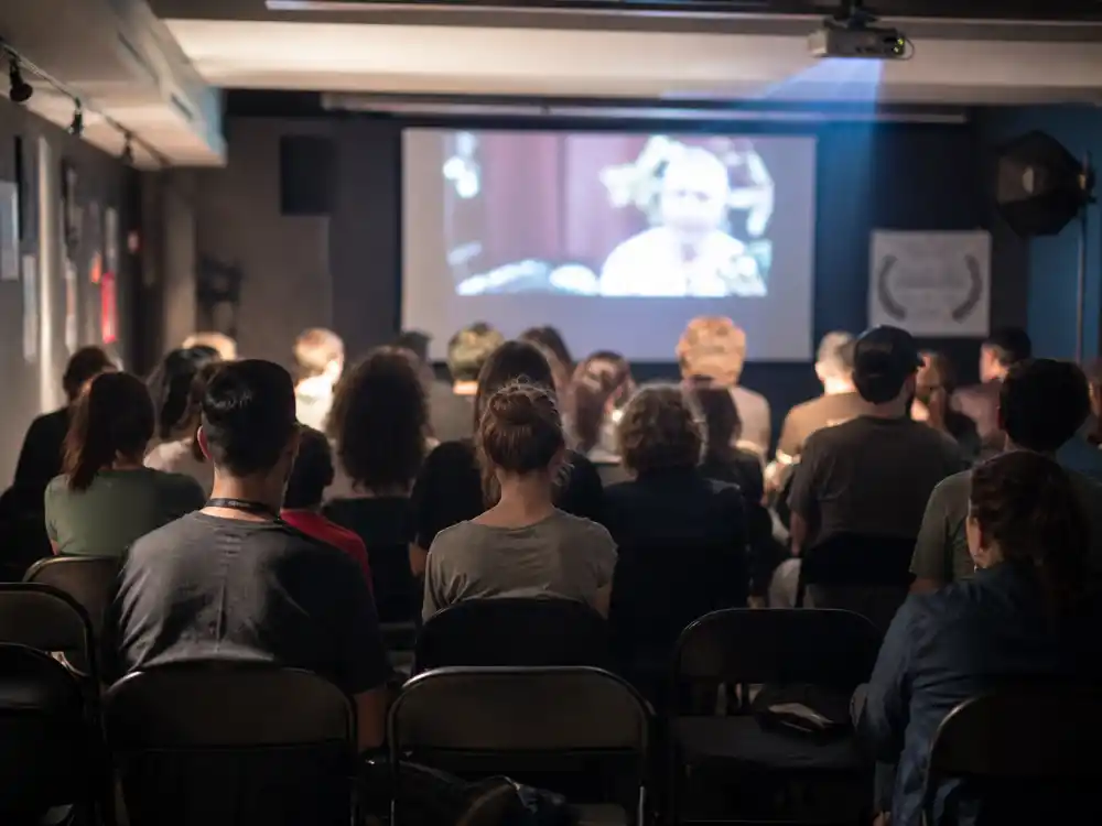 Small indie film festival screening room representing the Tara Reid indie film comeback in 2026