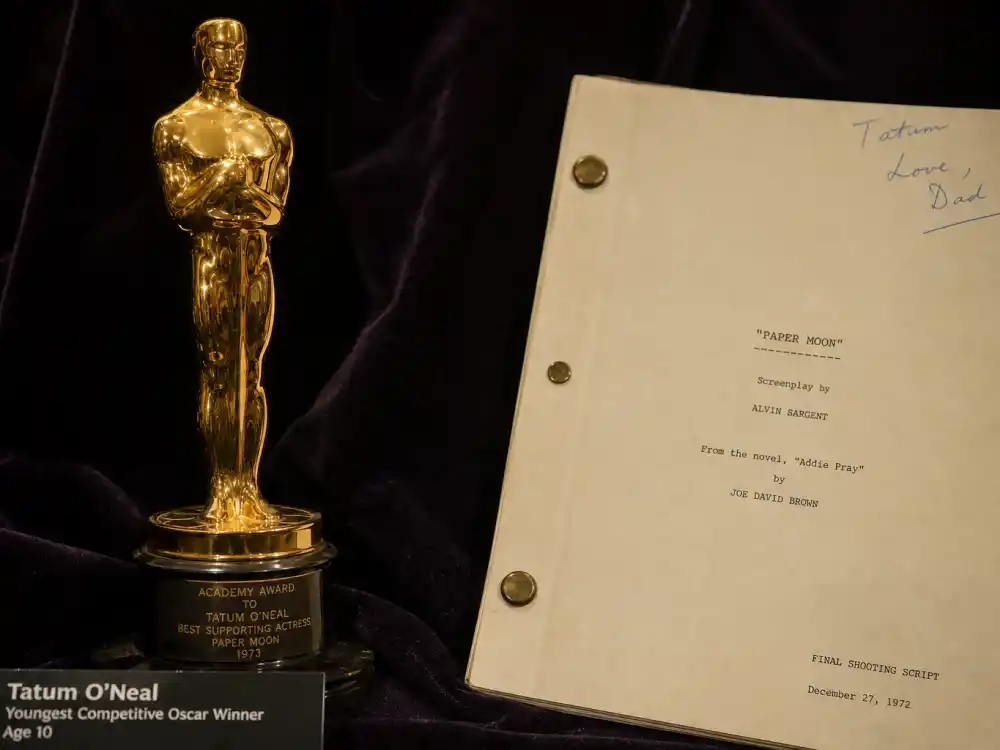 Vintage Oscar statuette beside a 1970s script for Tatum O'Neal youngest Oscar winner Paper Moon breakthrough