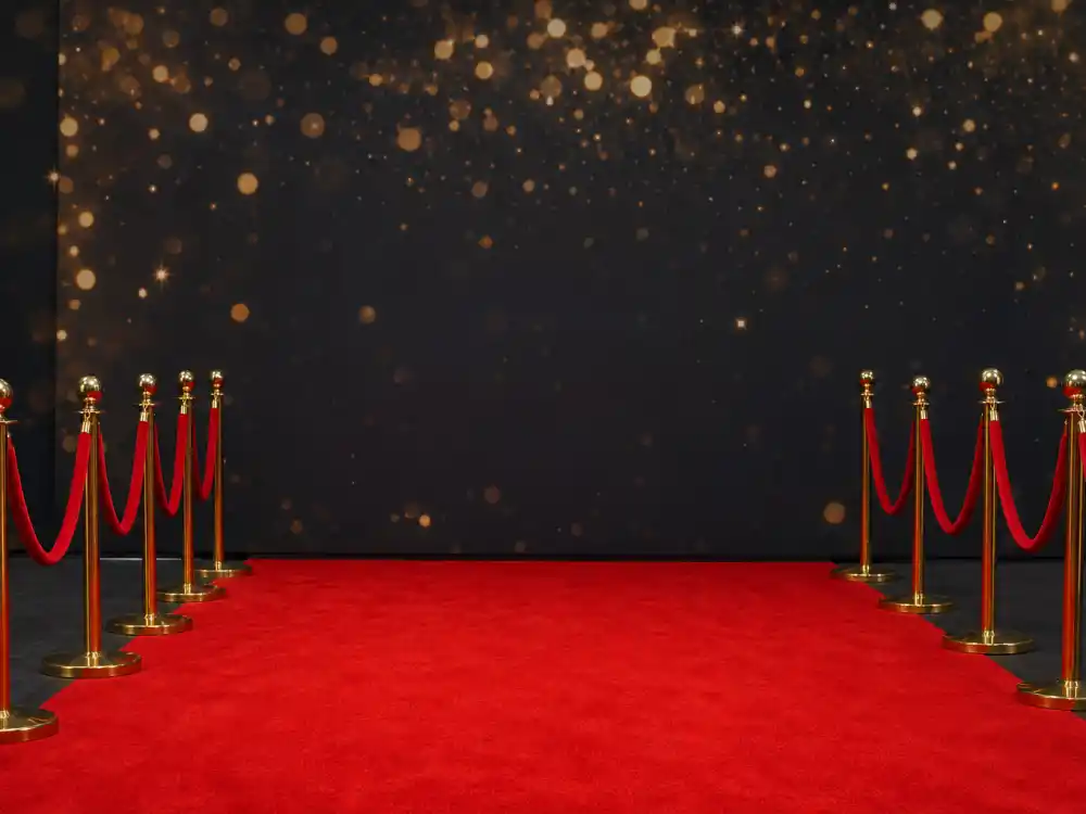 Music awards red carpet backdrop with golden bokeh sets the scene for Taylor Swift Grammy wins arrivals and afterparty headlines each February