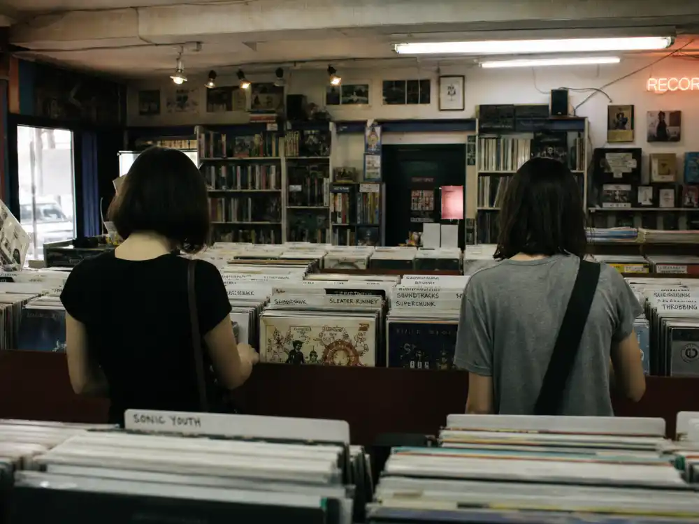 An indie record store interior evoking Ghost World and the Thora Birch indie-film peak