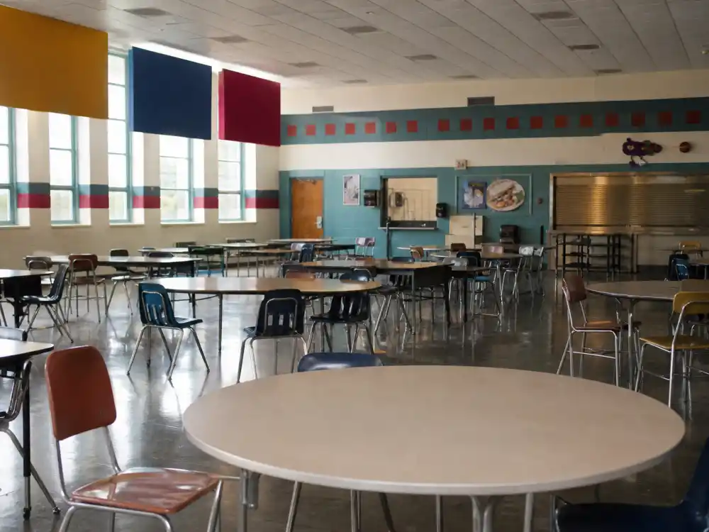 Quirky 2000s high school cafeteria for Tina Majorino Napoleon Dynamite Deb comeback in 2004