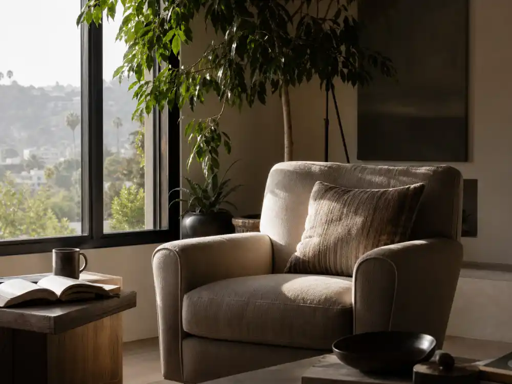 A calm sunlit Los Angeles living room reflecting the semi-retirement and private life of Tobey Maguire away from the spotlight