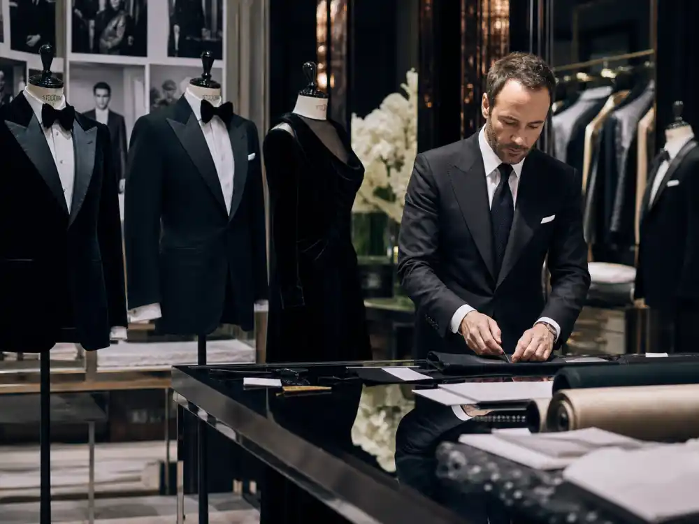 Peak-lapel tuxedos and structured gowns on dress forms defining the tailoring codes Tom Ford celebrity red carpet fans decode on telephoto carpets