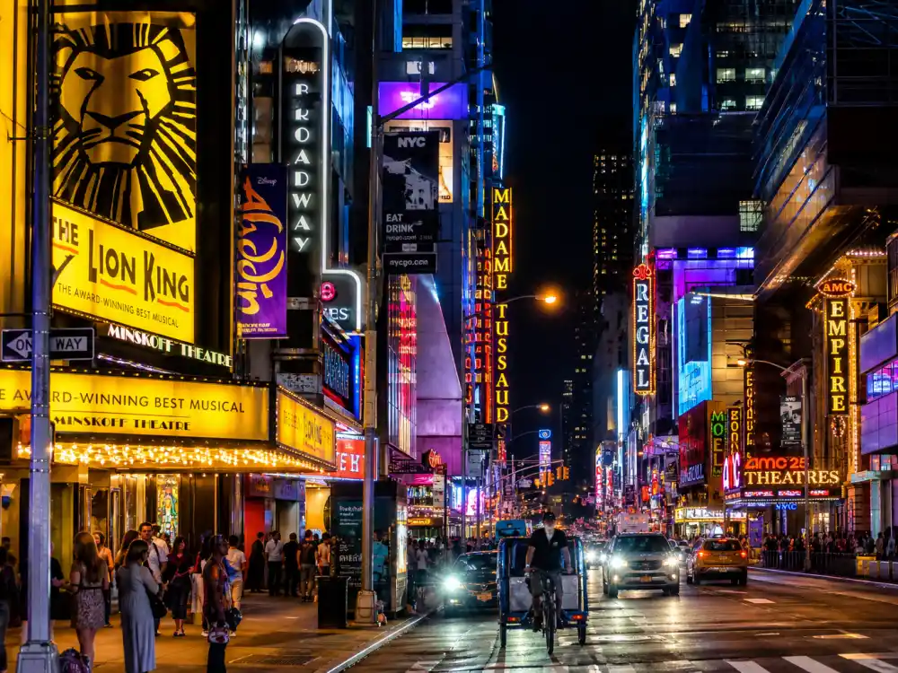 Broadway theater district marquees at night after ceremony when the Tony Awards 2026 winners list became quotable canon across theater media
